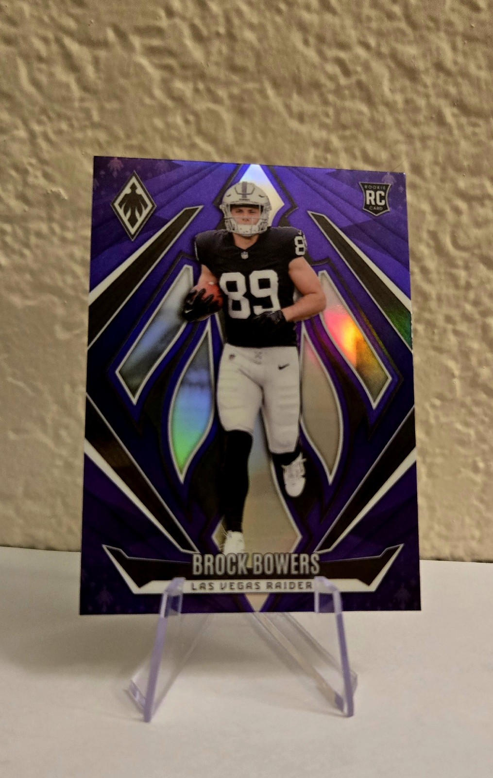 2024 Panini Phoenix - Rookies Brock Bowers #165 Purple Fade (RC)