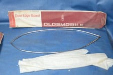 NOS 1971-76 Oldsmobile Delta 88 98 2dr Door Edge Guard Set Protector OEM 983262