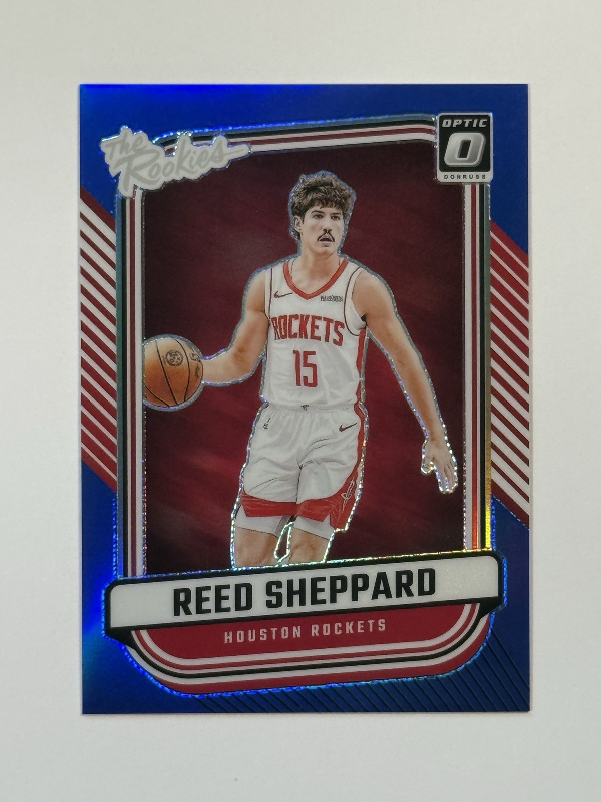 2024-25 Panini Donruss Optic Reed Sheppard Blue /49 The Rookies Prizm Rockets