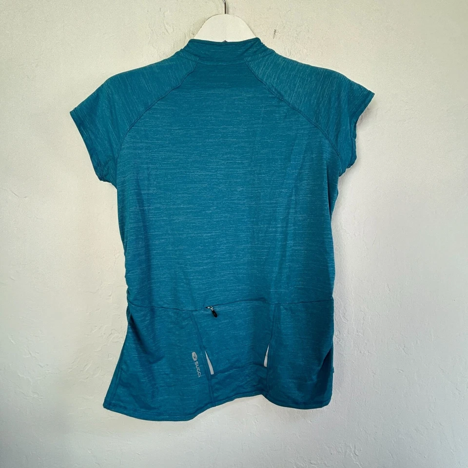 Camiseta deportiva para mujer Sugoi RPM grande semi ajuste verde azulado manga corta camiseta de ciclismo activo Foto 2 de 4