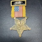 Grand Army of the Republic membership medal with a post commander top bar