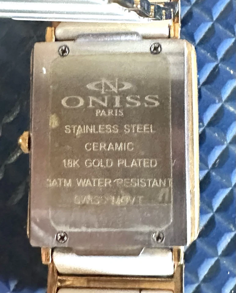 Reloj para mujer Oniss Paris con fecha rectangular de cerámica blanca acentuada con diamantes Foto 3 de 4