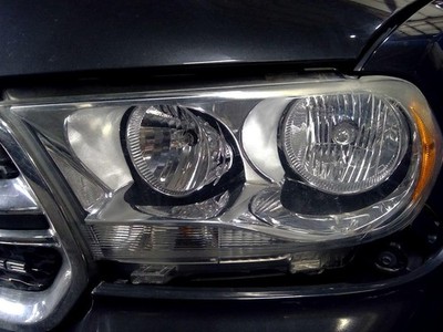 Used Left Headlight Assembly fits: 2011 Dodge Durango halogen chrome bezel Left