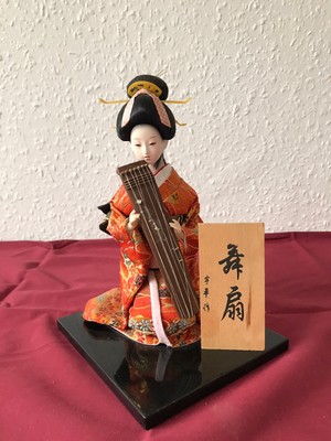 porcelain geisha doll