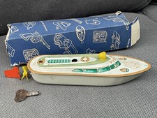 Ancien jouet tôle mécanique bateau police Western Germany + boite
