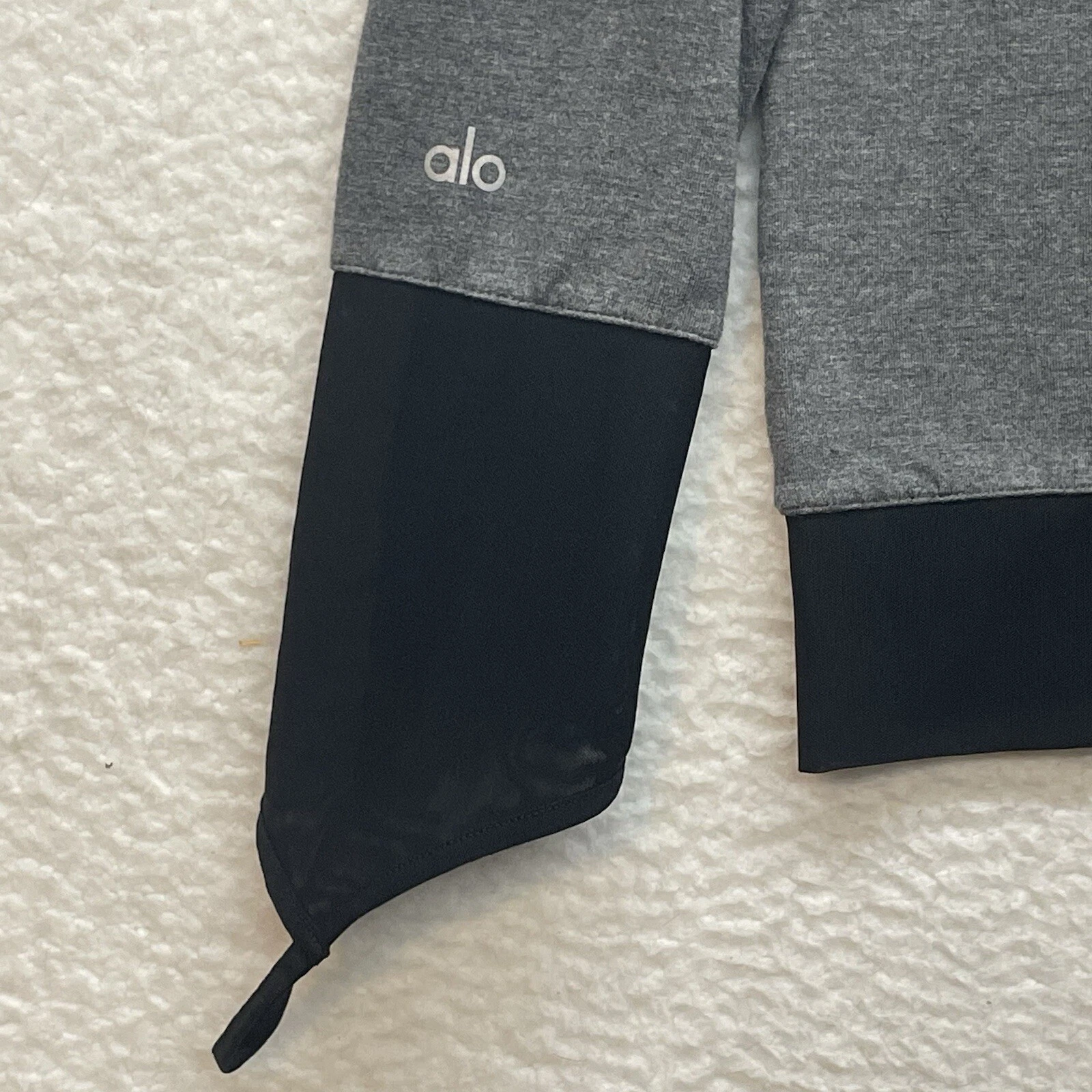 alo-yoga serene mesh cuff finger loop gym workout shirt