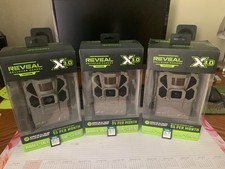 TACTACAM REVEAL TRAIL CAMERAS with tree mounts and 32GB SD cards.