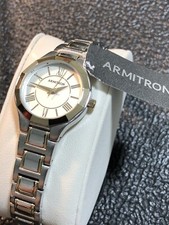 Reloj pulsera Armitron para mujer tono plata/oro números romanos batería nueva nuevo con etiquetas