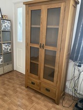 SOLID OAK DISPLAY CABINET WITH GLASS DOORS AND TWO DRAWERS