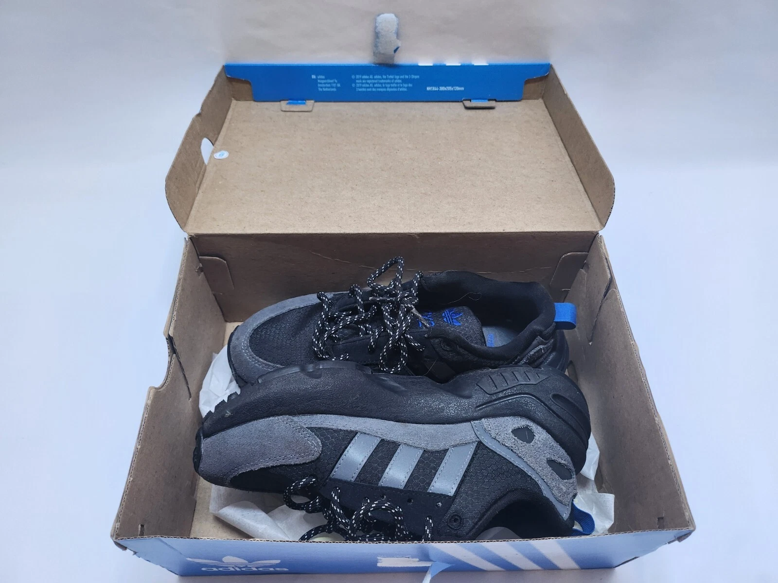 Taglia UK 4 bambini Adidas ZX 22 J Boost nero e grigio.