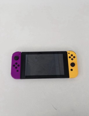 Nintendo Switch Konsole mit neon lila und gelben Joy-Con Controllern in sehr gutem Zustand