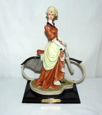 Leonardo Collection Lady On Bike Resin Figure 11 1/2" Dark Green Eyes Brown Hair