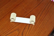cale-porte - bloque-porte - base métal - rouleaux plastique - 13 x 3,5 cm - BE