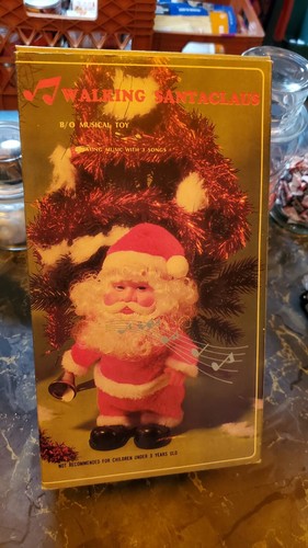 Papá Noel caminando de colección - toca canciones y mueve pies viene en caja original - Imagen 11 de 15