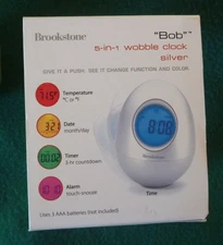 Brookstone "Bob" 5-in-1 Wobble Oval Egg Time Date Alarm Timer Temp Silver New