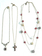 Gold tone chains with red stone Cross pendant and beads. You get all 3 necklaces
