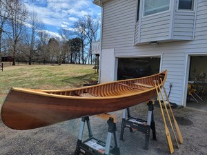 Vintage 15-foot cedar and ash handmade wooden canoe with 3 paddles