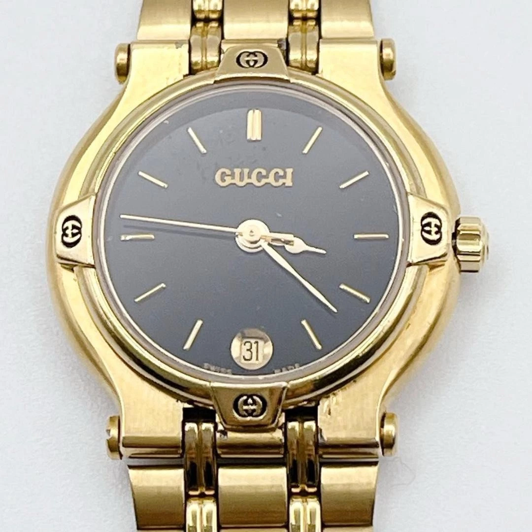 Excellente montre femme GUCCI 9200L en état de marche, dorée, noire