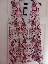 BOX 708 ladies dress new tags pretty little thing  pink mix low cutfront size 10