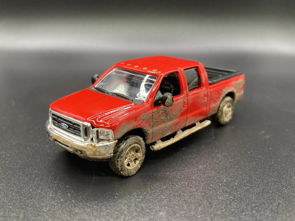 Camión de barro fundido a presión Ford F-250 Super Duty 2004 diésel 4x4 personalizado 1/64 Foto 2 de 4