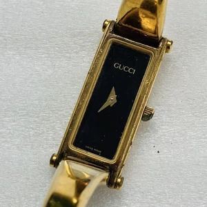 Montre femme Gucci 1500 dorée noire élégante suisse vintage
