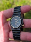 Vintage Seiko Sports 100 quartz wristwatch, reference 6923-7060, with black dial