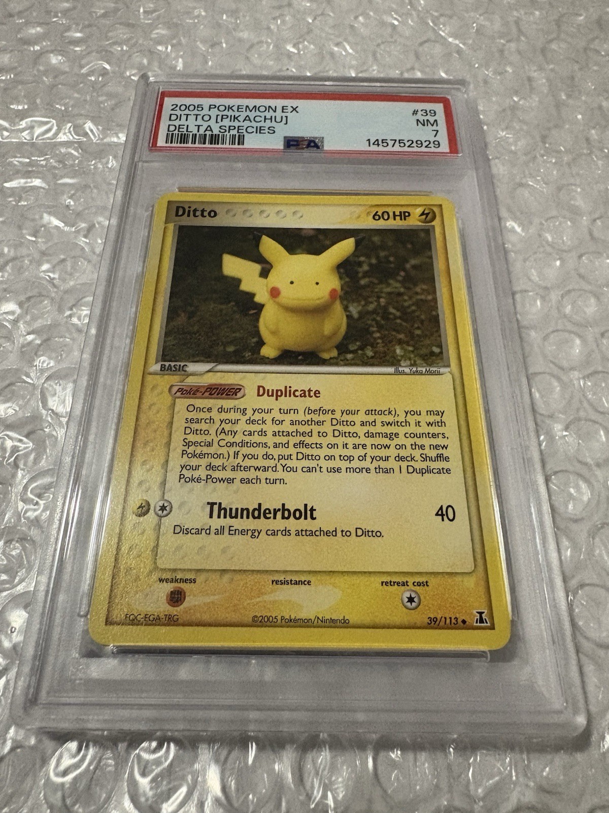 Pokémon EX Delta Species Ditto (Pikachu) 39/113 PSA 7 Rare Poké-Power 2005