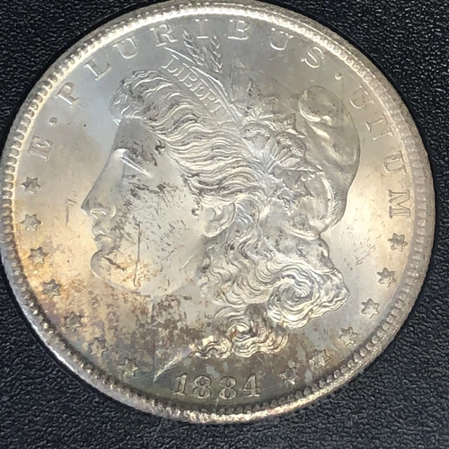 1884 CC MORGAN SILVER DOLLAR "NGC MS63" - TONING COLORS OF THE RAINBOW BOX/CERT