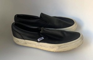 vans black perforated leather slip on