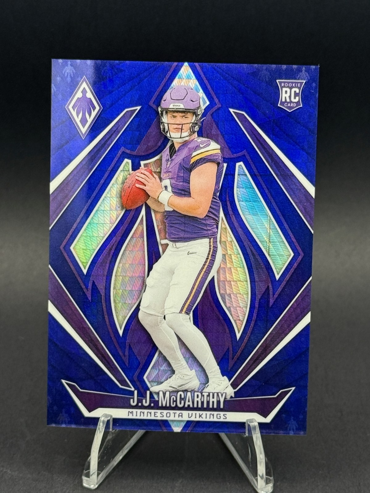 2024 Panini Phoenix J.J. McCarthy Rookie Blue 63/70 #185 RC Vikings