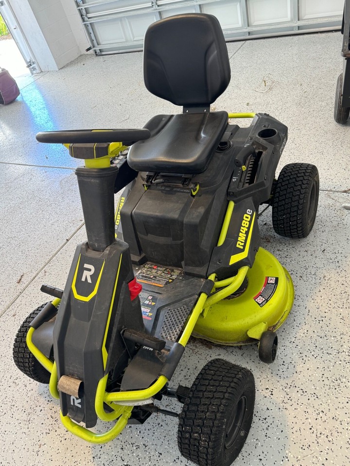 Ryobi RM480e Electric Riding Lawn Mower comes with 10 cu. Feet Steel