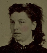 WOMAN WITH MESSY HAIR. TINTED TINTYPE, PERIOD PAPER MAT.
