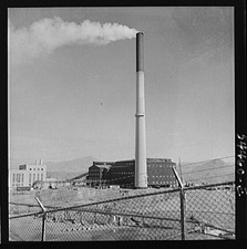 Photo:Industrial Smokestack Factory Plant 1900s Chain Link Fence Smoke