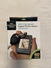 The Sharper Image 1.4 Digital Photo Album with Keychain USB 2.0 Recharge. NEW