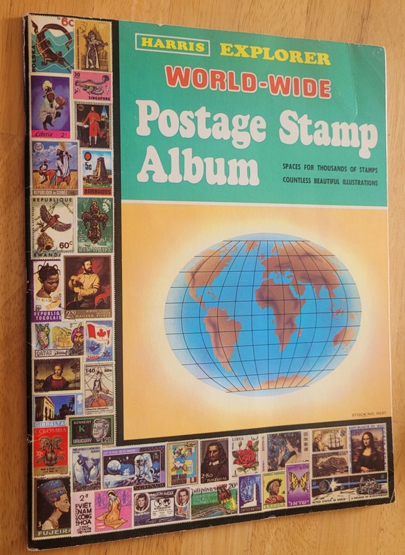 Vintage 1981 Harris Explorer Postage Stamp Paperback Album Book + Stamps