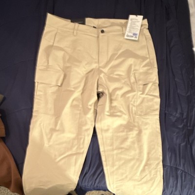 Wear We Made This beige cargo pants with stretch fabric and button accents