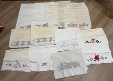 12 Vintage Various Embroidered White Pillow Cases..See Description