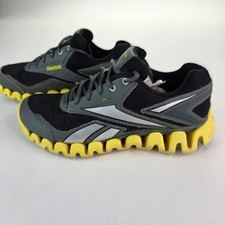 Zapatos para correr Reebok ZigTech negros y amarillos para hombre 6 para mujer 7,5