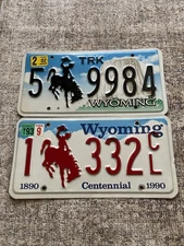 Wyoming Red & Black Cowboy License Plate Set 1993 “Centennial” & 2002 Truck