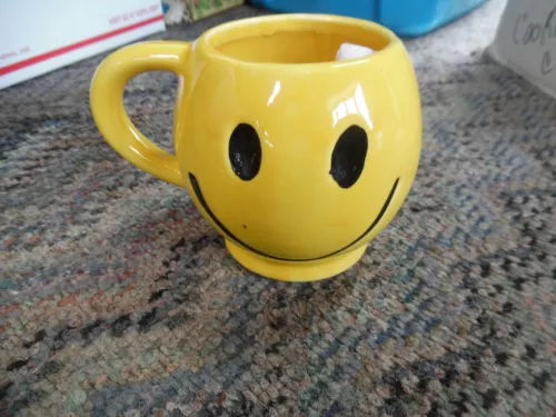 Vintage McCoy ceramic yellow smiley face mug NEW