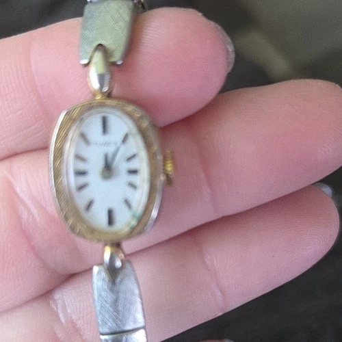 Timex Gold & Silver Tone Oval Analog Women's Wristwatch White Dial Bracelet