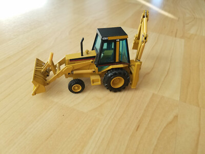 Caterpillar Cat 428B Baggerlader Mobilbagger Tieflöffelbagger NZG 1:50