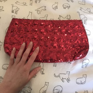 red sparkly clutch bag