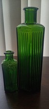 2 Green hexagon shaped poison bottles