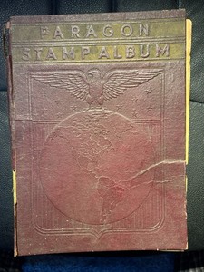 1935 Paragon World Stamp Album with numerous early 1900's international stamps.