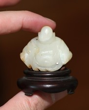 antique Chinese carved white jade buddha on stand, Qing Dynasty, 18th Century.