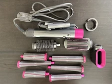 Pink Dyson Air Wrap with Attachments and Storage Case