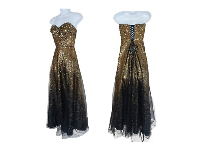 black and gold corset dress Armor gold-plated corset hand-crafted from solid brass paired with a black  silk crêpe skirt