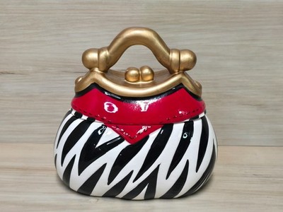 David's Cookies A Bite Above the Rest Zebra Pattern With Red and Gold Cookie Jar