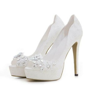 white pumps with flowers